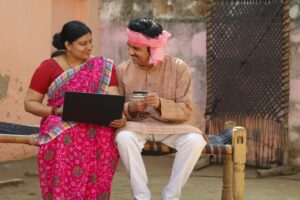 Rural man and woman making digital payment